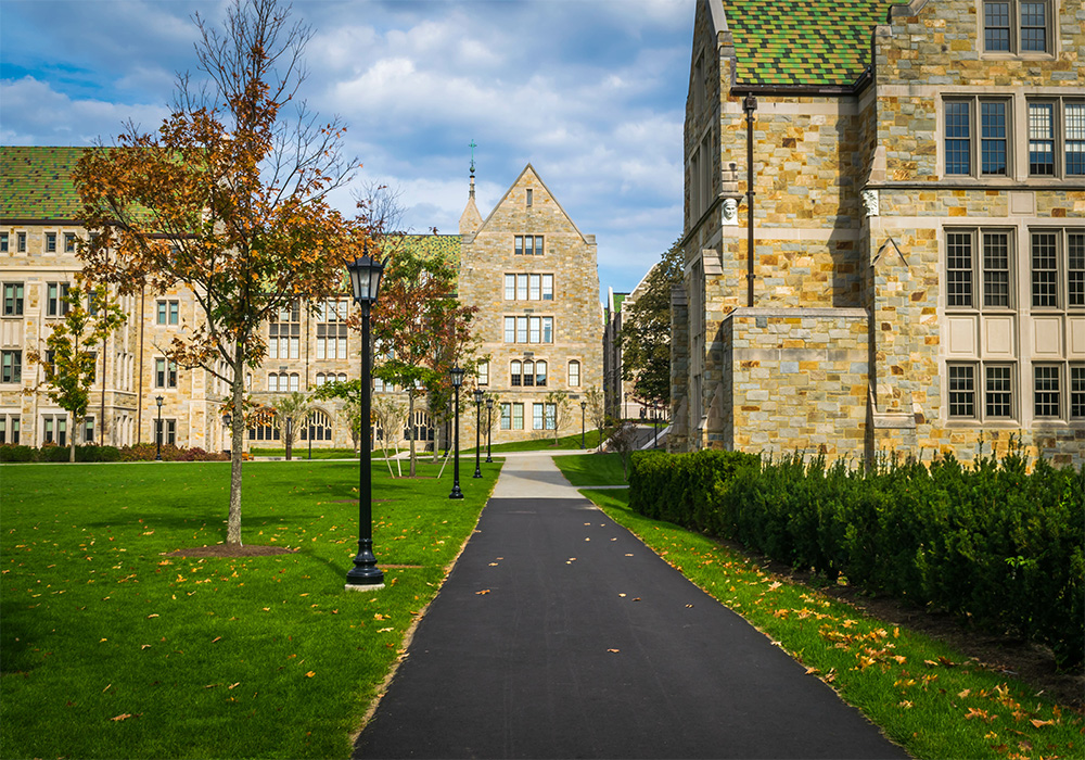 College campus classroom buildings surrounded by grass lawns