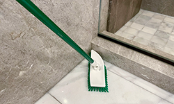 No-Knees Floor Scrubber in bathroom