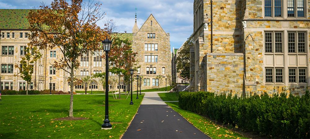 College campus classroom buildings surrounded by grass lawns