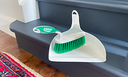 Dustpan and brush on stairs