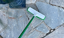 Broom oudoors on stone pathway