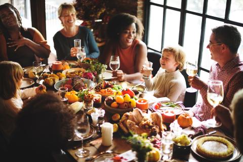 Family having Thanksgiving dinner together